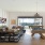 Large well lit clubhouse with ample seating and a billiard table in San Antonio luxury apartments